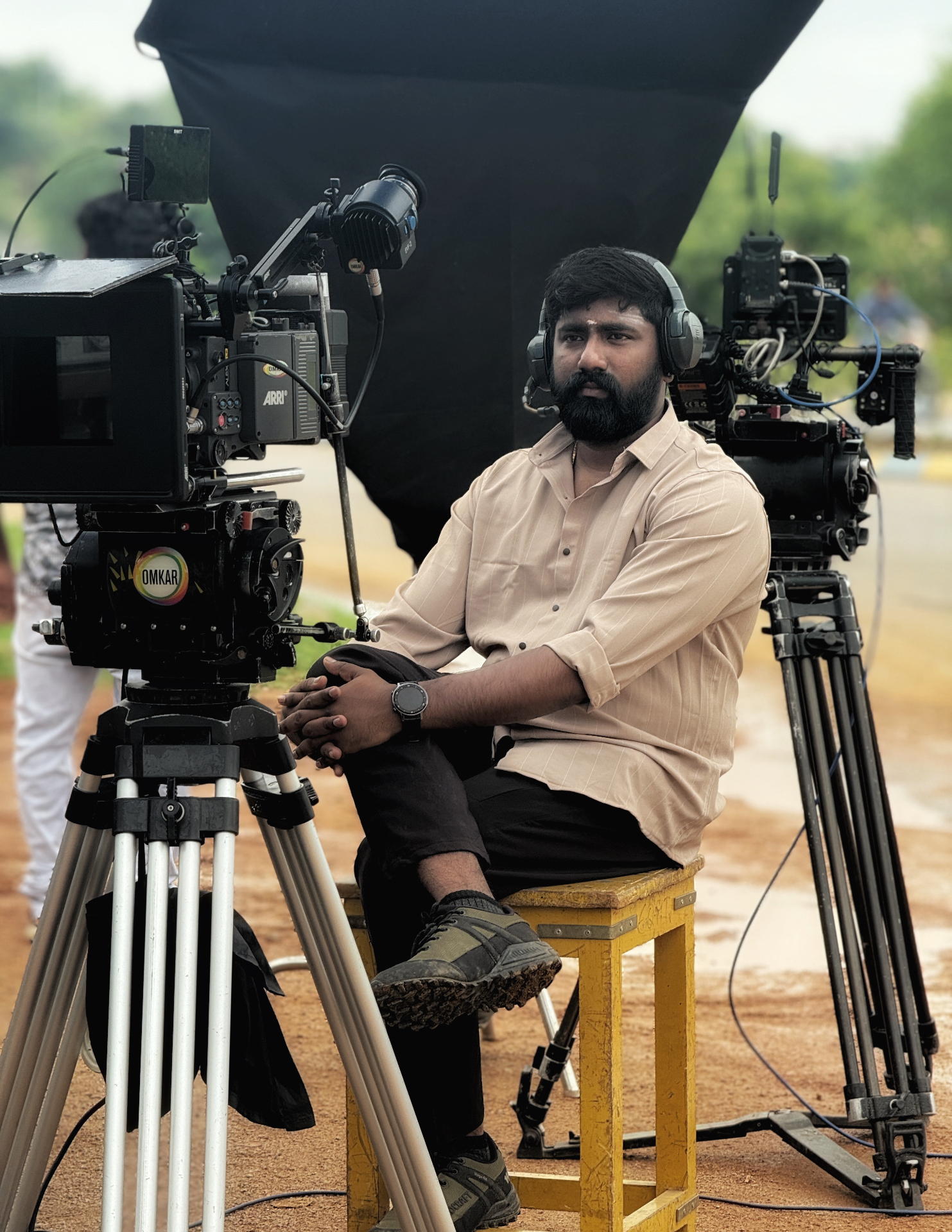 Portrait of Arjun Raja with film camera